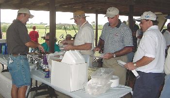 Robbie serving up good ol BBQ grub.