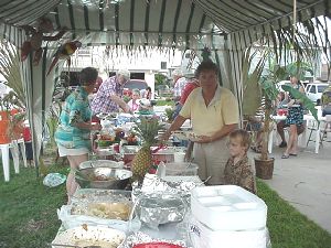 Vicki & Cole getting some of the great food.