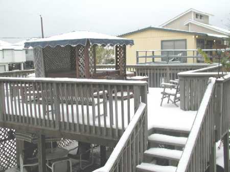 Griffin's hot tub deck covered in snow.