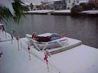 Patty Peacock is snow bathing on her dock.
